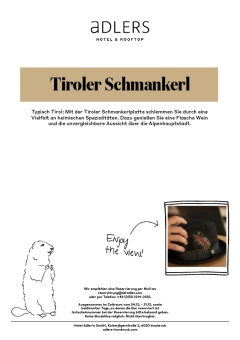 Tiroler Schmankerl mit einer Flasche Wein