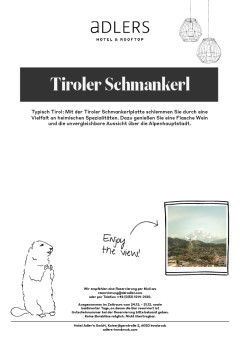 Tiroler Schmankerl mit einer Flasche Wein